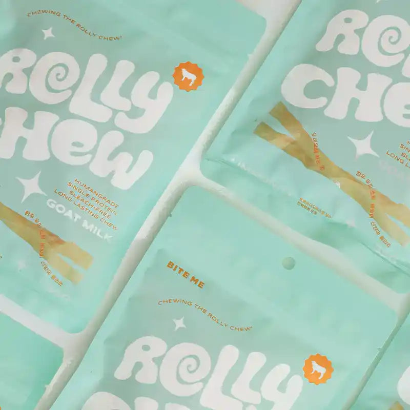 Light blue packages of "Rolly Chew Goat Milk" arranged next to each other.