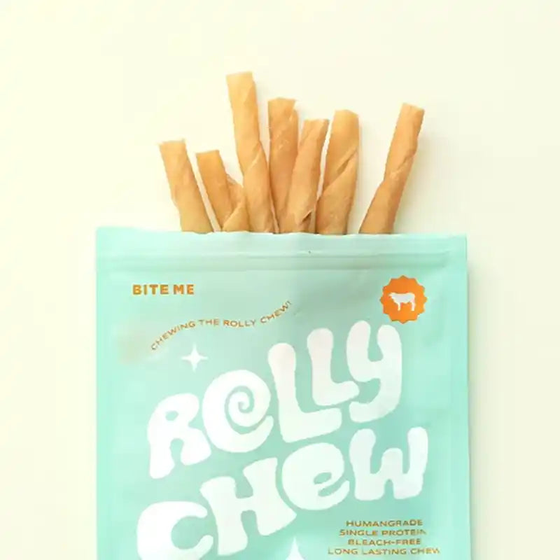 A package of "Rolly Chew" dog treats with several twisted chew sticks sticking out of the top.