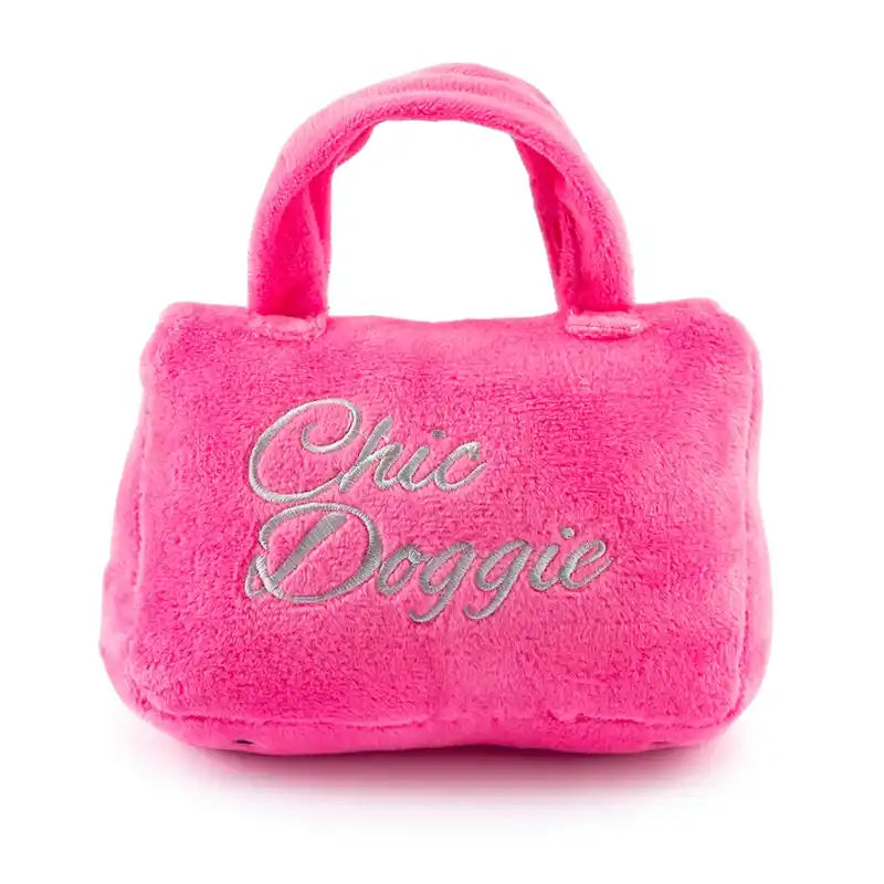 Pink plush handbag dog toy.