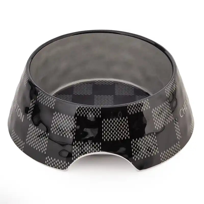 Black pet bowl with checkered pattern on a white background