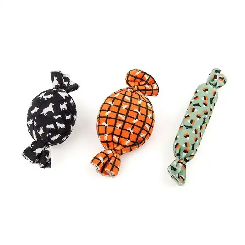 Three plush candy-shaped dog toys.