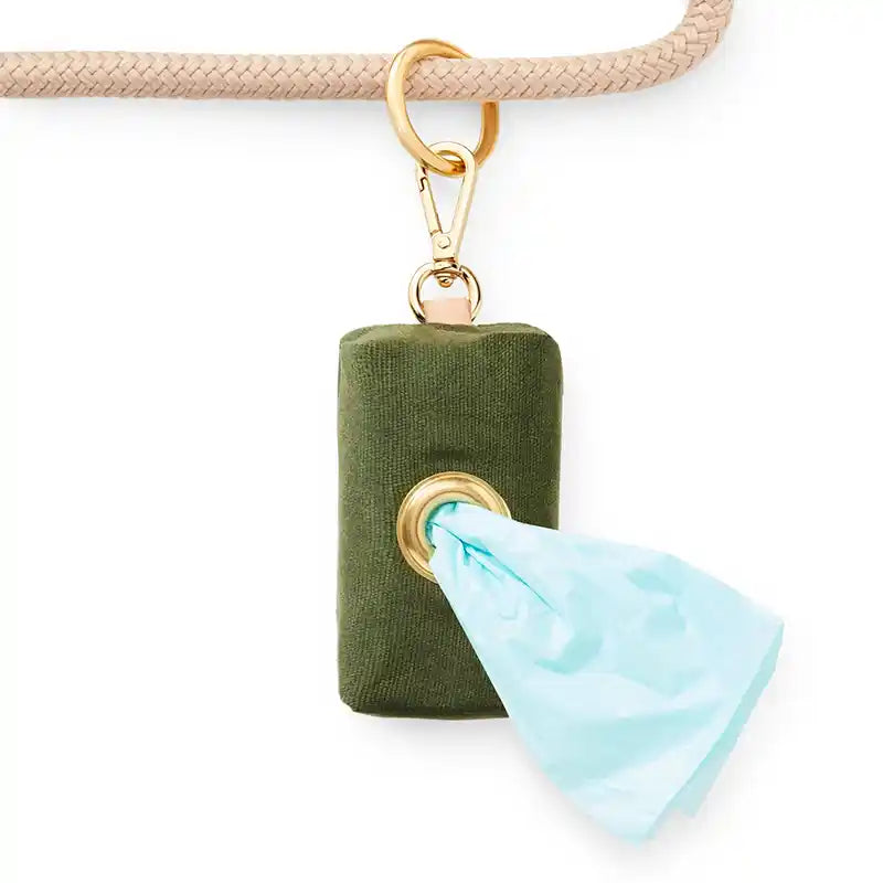 Olive green canvas poop bag hanging on a rope leash