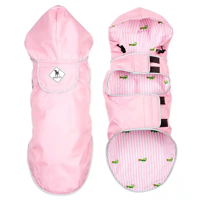Pink dog rain coat with pink striped interior and alligators on a white background