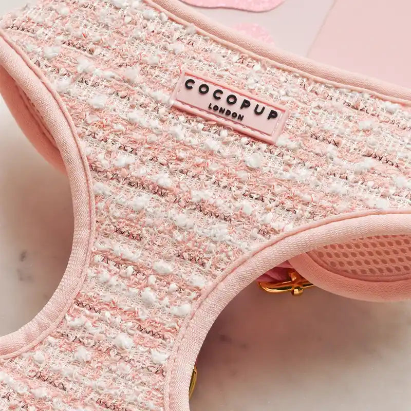 Close-up of a pink textured tweed dog harness with 'Cocopup London' branding.
