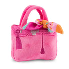 Pink plush handbag dog toy.