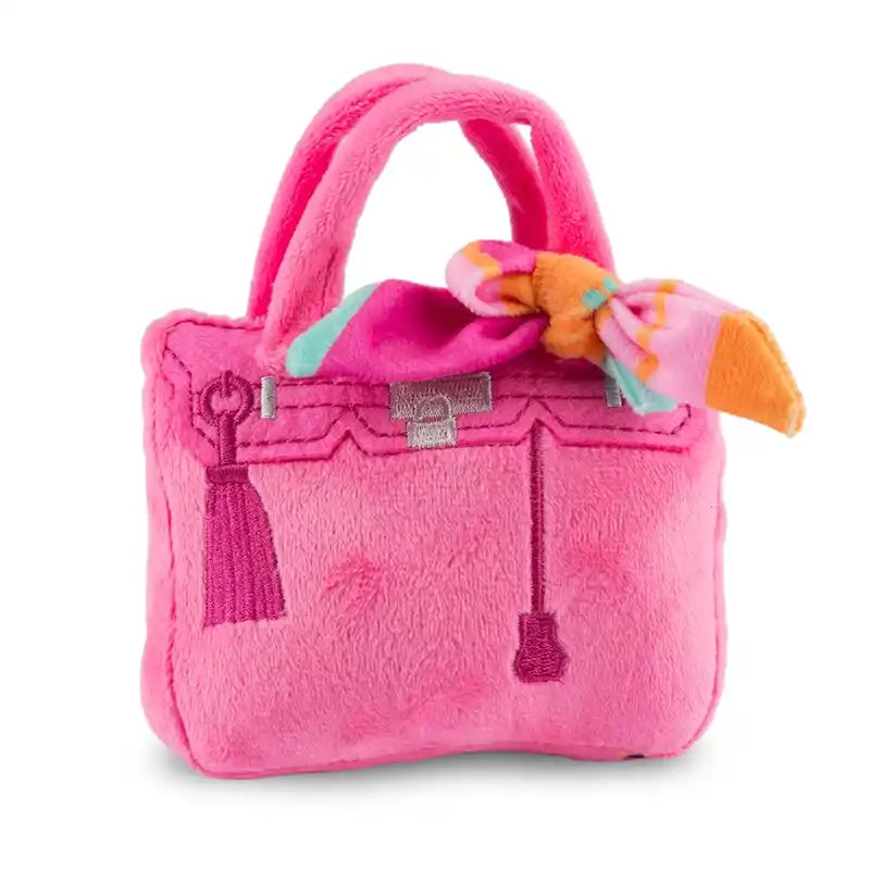 Pink plush handbag dog toy.