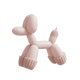 Pink balloon dog toy on a white background