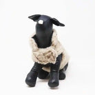 beige faux fur coat on dog mannequin