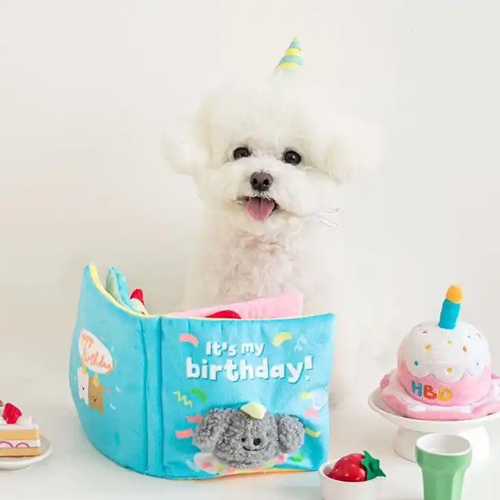 birthday book snuffle dog toy staged with dog
