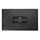 Black checkered pet placemat with 'Chewy Vuiton Paris' branding 