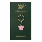 Butterfly pet collar charm on a green card with 'The Foggy Dog' branding.