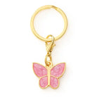 Pink butterfly dog collar charm on a gold ring 