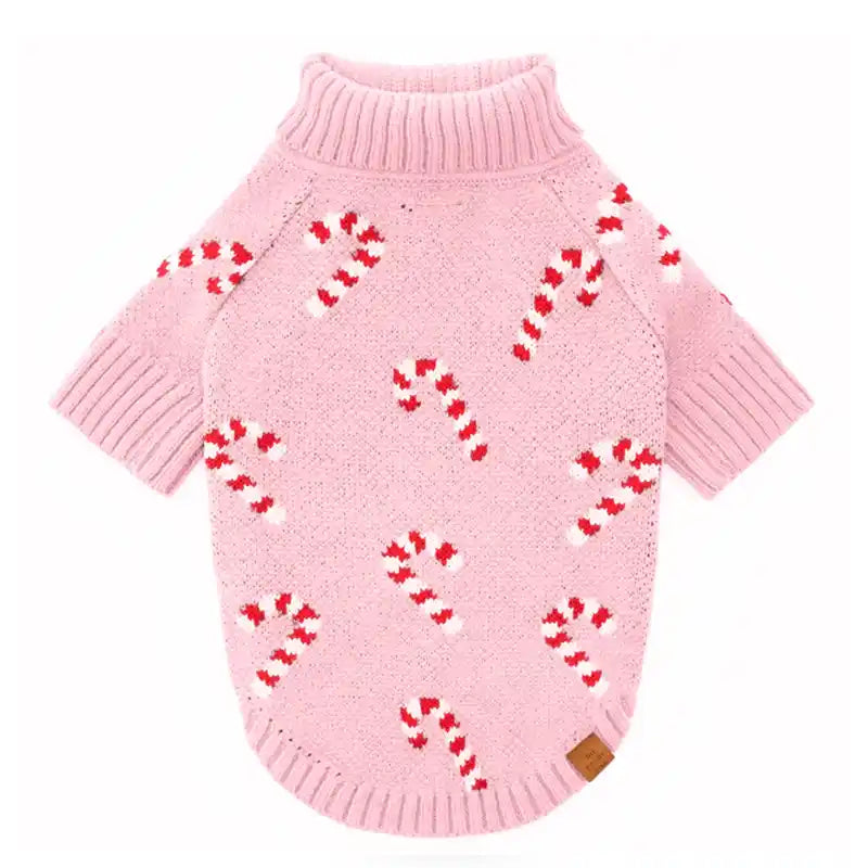 Pink knitted dog sweater with a candycane repeat design