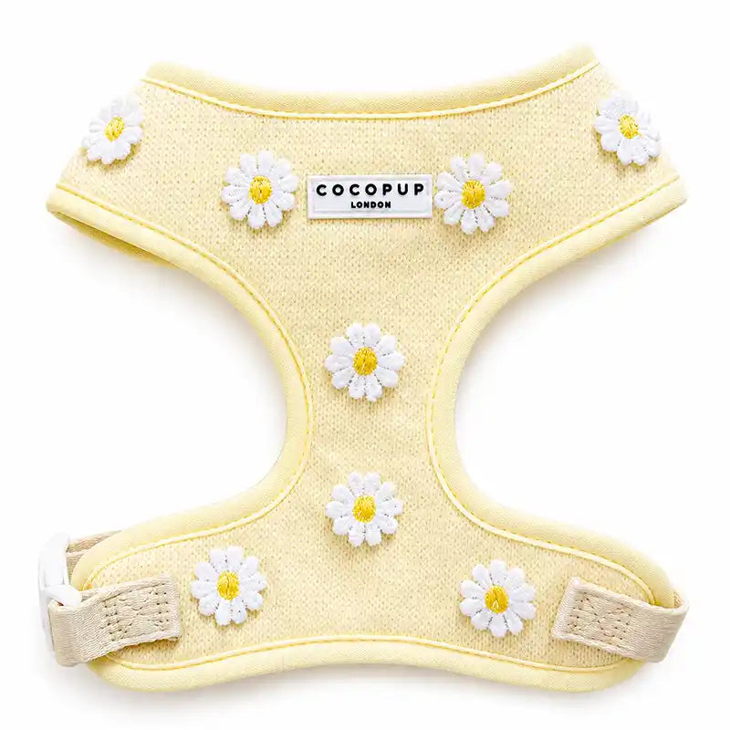 Yellow pet harness with daisy flower designs and 'Cocopup London' branding on a white background