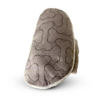 Underside of plush dog toy with bone pattern.