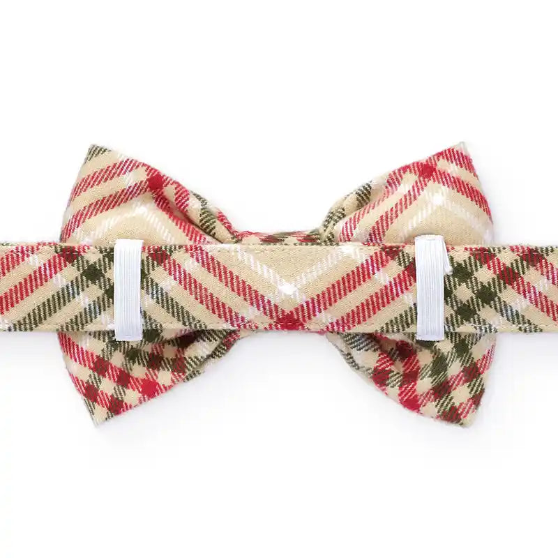Plaid bow tie with red, green, and beige colors on a white background