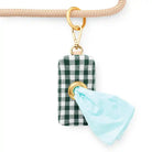 evergreen gingham waste bag dispenser hanging on a leash