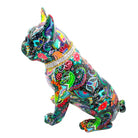 Side view of bright colored flower design laminated onto a Frenchie statue with a diamond collar on a white background