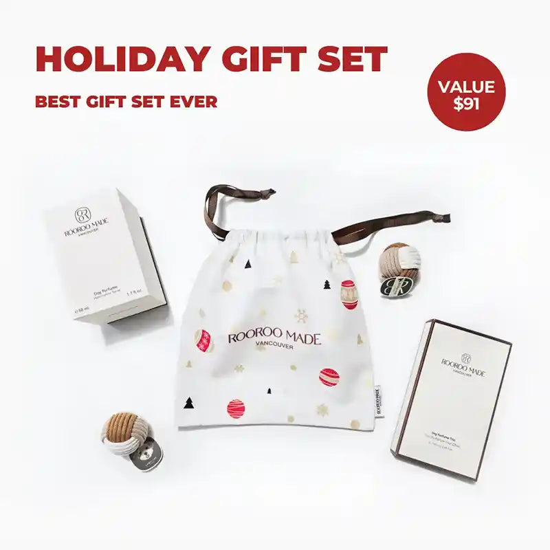 Holiday dog perfume set with drawstring bag and products on a white background, featuring 'Rooroo Made' branding.