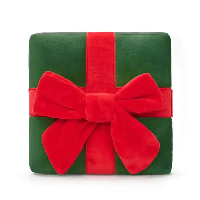 Green gift box dog snuffle toy with a red ribbon and bow on a white background