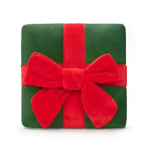 Green gift box dog snuffle toy with a red ribbon and bow on a white background