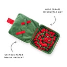 Green and red snuffle mat with crinkle paper inside on a white background