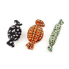 Three plush candy-shaped dog toys.