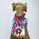 Gold Iggy statue wearing a retro Phillies dog bandana