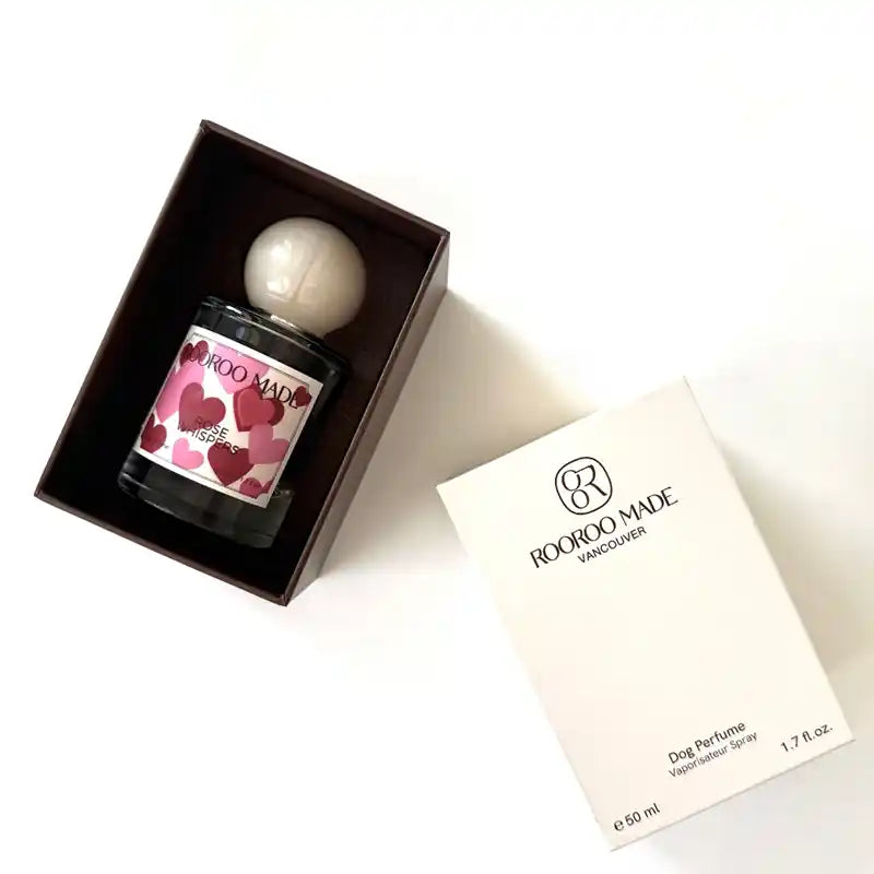 Limited-edition dog perfume bottle in a box with heart pattern label.