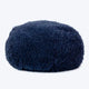 A navy, fluffy dog bed made of recycled fiber, designed to feel like a cloud.