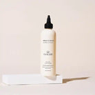 GOLDIE Miracle Dog Ear Rinse bottle on a light pink background