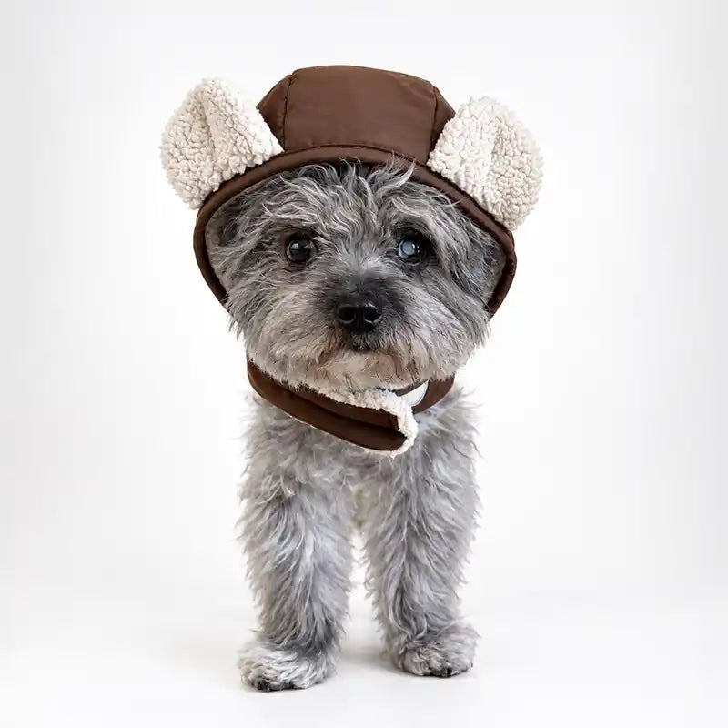 Brown puffer dog harness with a fleece-lined hood and plush bear ears.