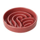 Pink ceramic wave slow feeder bowl on a white background