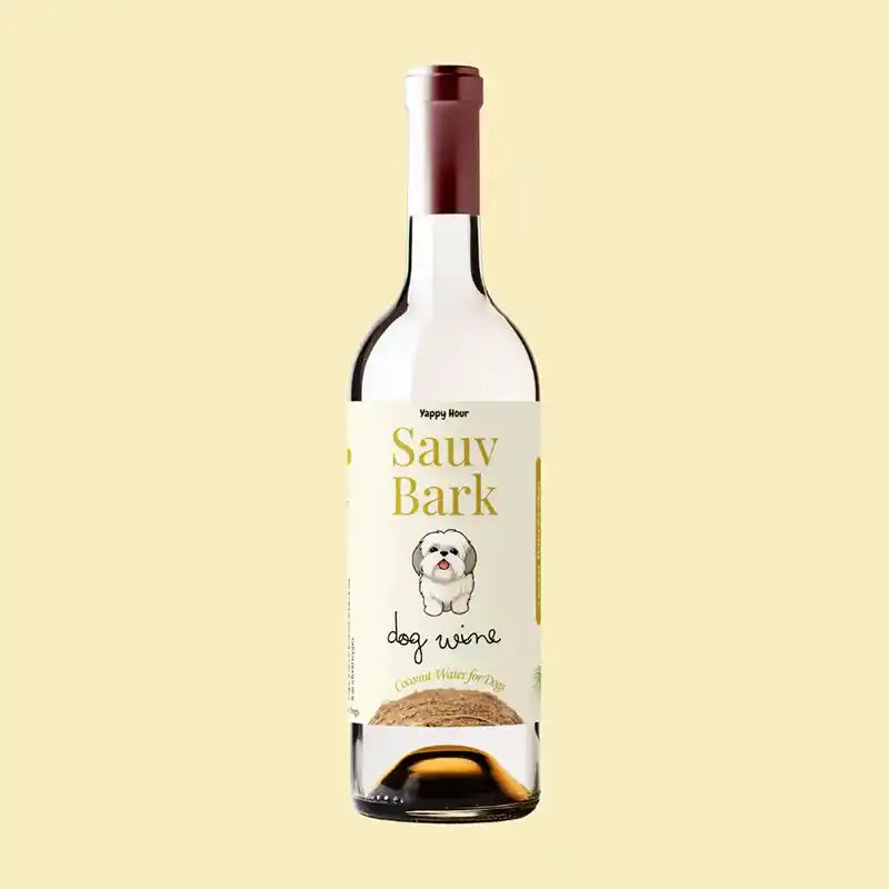 Bottle of 'Sauv Bark' dog wine with a label featuring a dog illustration on a beige background
