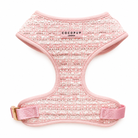 Pink tweed dog harness with 'CocoPup London' branding on a white background