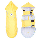 Yellow pet rain coat with a hood on a white background