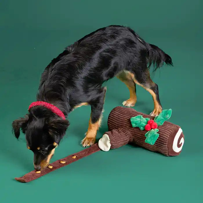 dog playing with Yule Log Interactive Snuffle Dog Toy